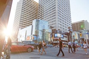 Street view of Yonge and Eglinton with people crossing