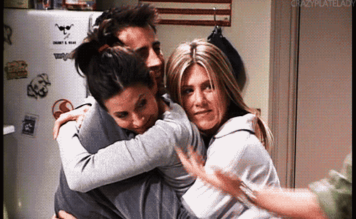 rachel monica and joey having a group hug from tv show friends