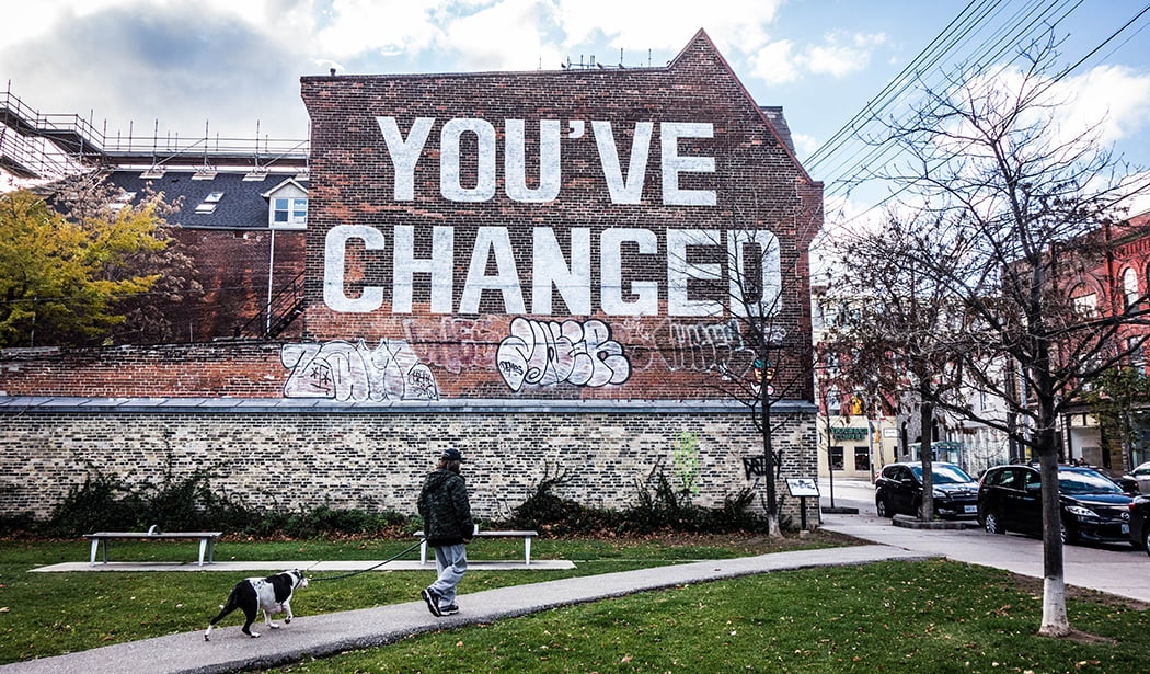 queen street west with graffiti "you've changed"