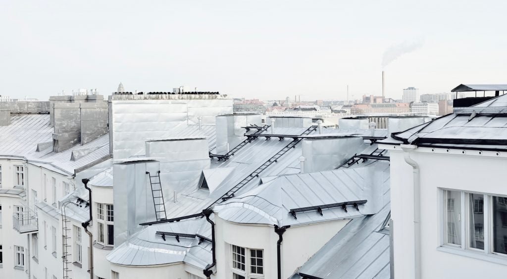 high shot showing rooftops of white apartments