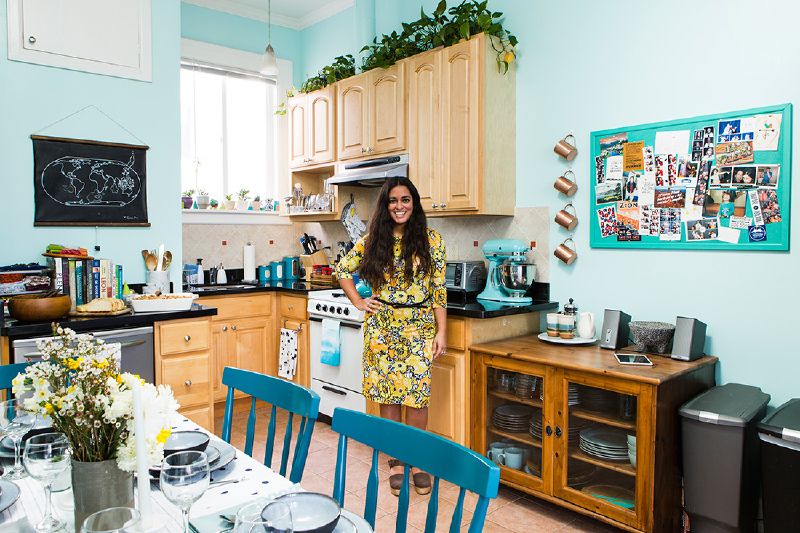 woman in kitchen with blue walls