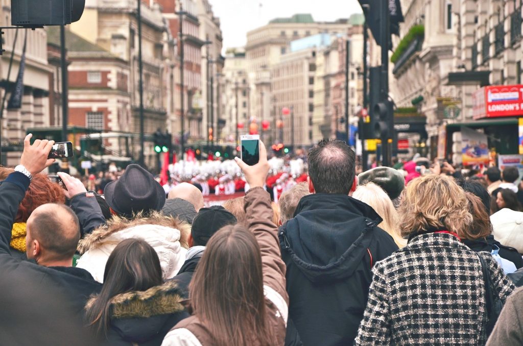 Crowd viewing parade on street